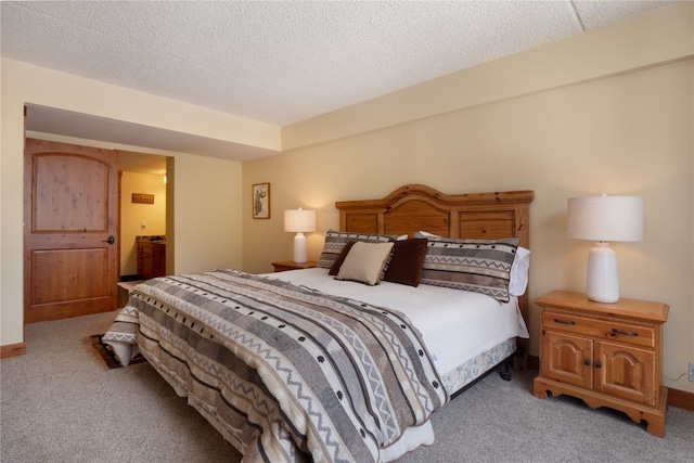 bedroom with light carpet and a textured ceiling