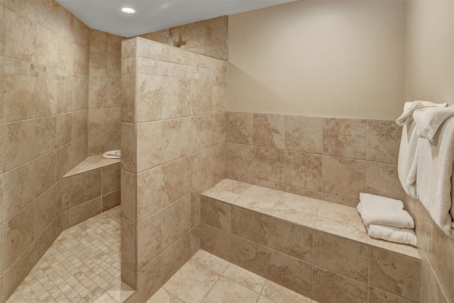 bathroom featuring tiled shower