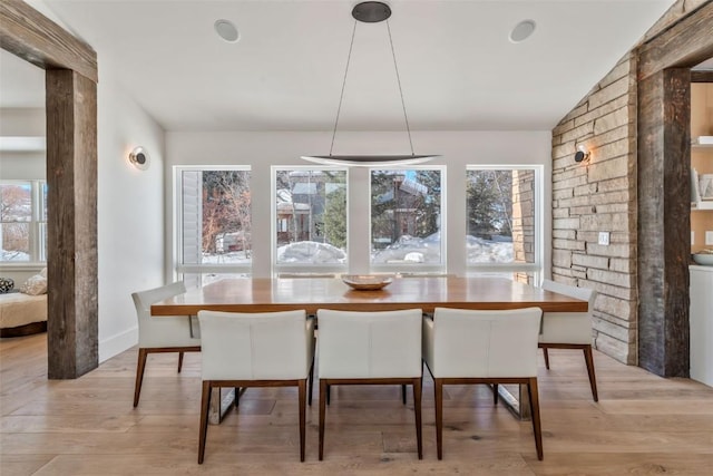 dining room featuring a healthy amount of sunlight, light wood-style flooring, and breakfast area