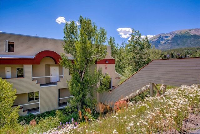 back of house with a mountain view