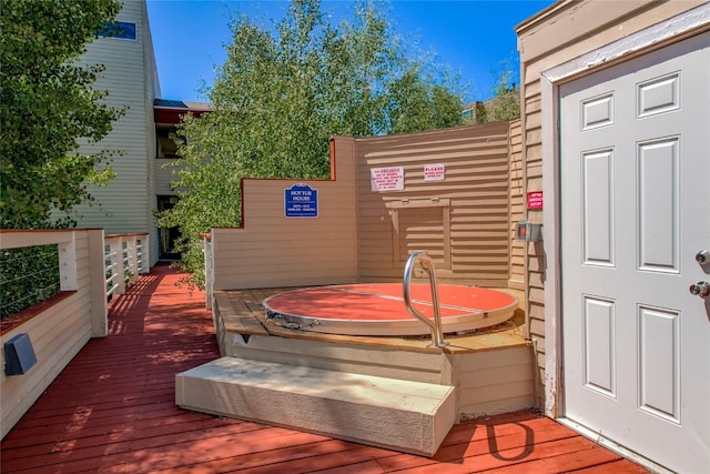 deck with a hot tub