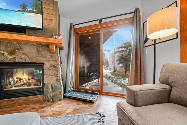 interior space with a fireplace and hardwood / wood-style flooring