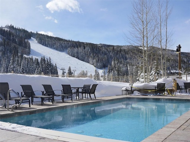 view of snow covered pool