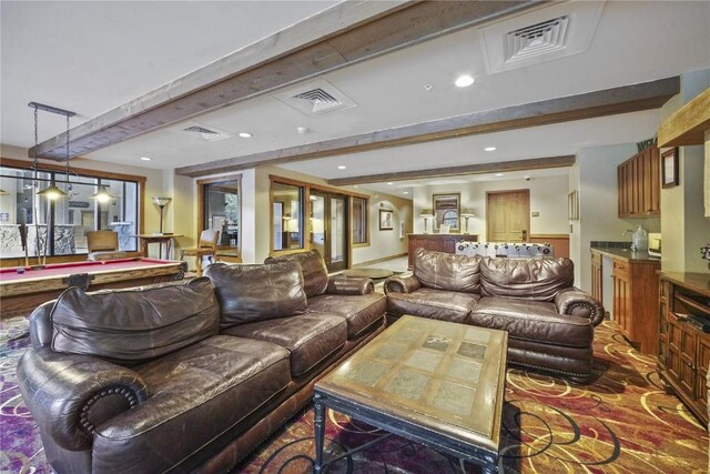 living room with beam ceiling and billiards