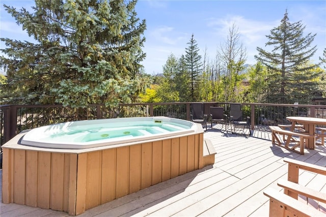 wooden terrace featuring a hot tub