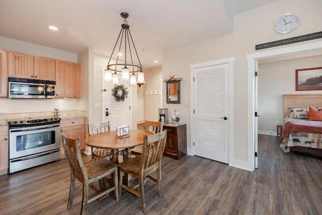 dining area featuring dark wood-type flooring