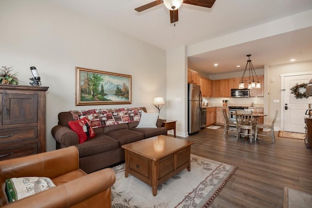 living room with ceiling fan and wood-type flooring