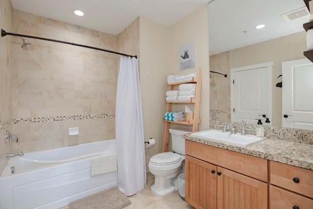 full bathroom featuring tile patterned floors, vanity, toilet, and shower / tub combo