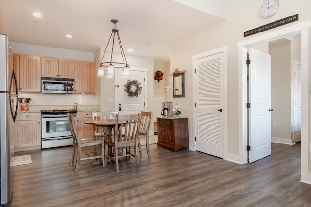 dining area featuring dark hardwood / wood-style floors