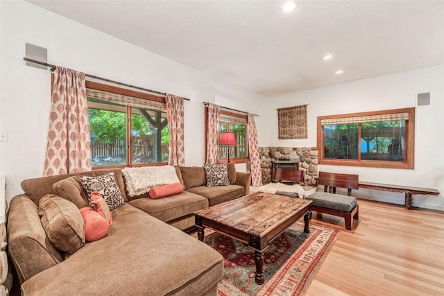 living room featuring a fireplace and light hardwood / wood-style floors