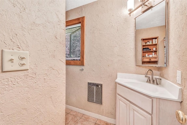 bathroom with tile patterned flooring and vanity