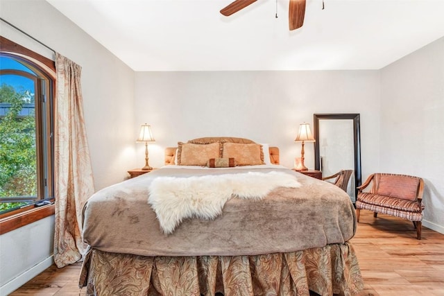 bedroom featuring light hardwood / wood-style flooring and ceiling fan