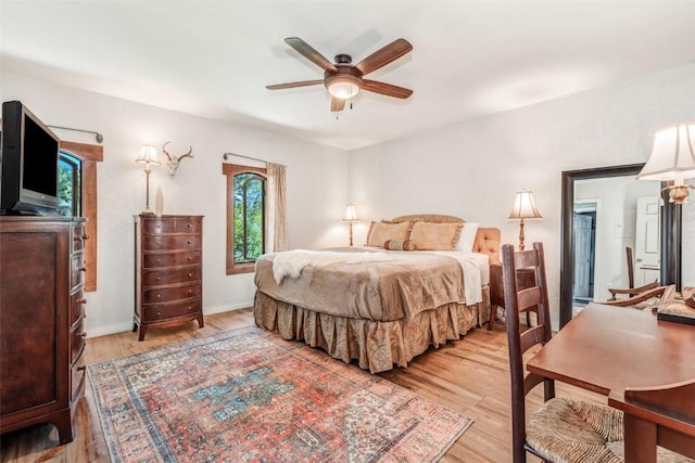 bedroom featuring ceiling fan and light hardwood / wood-style flooring