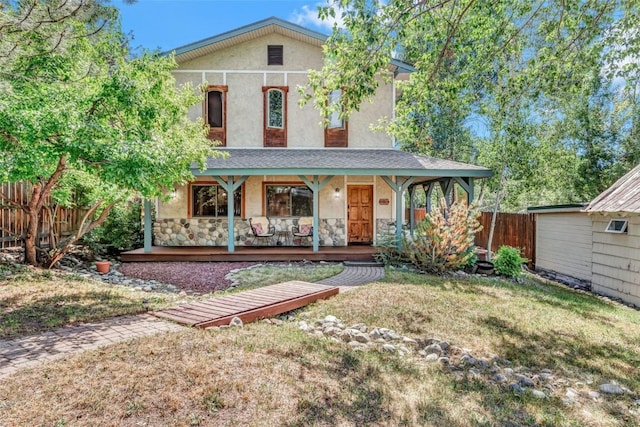 view of front of property with a porch and a front yard