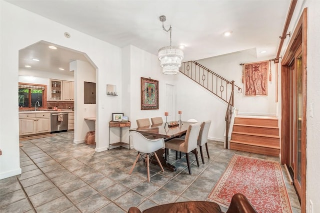 dining area with a notable chandelier and sink