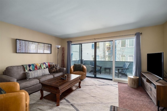 living area featuring light colored carpet