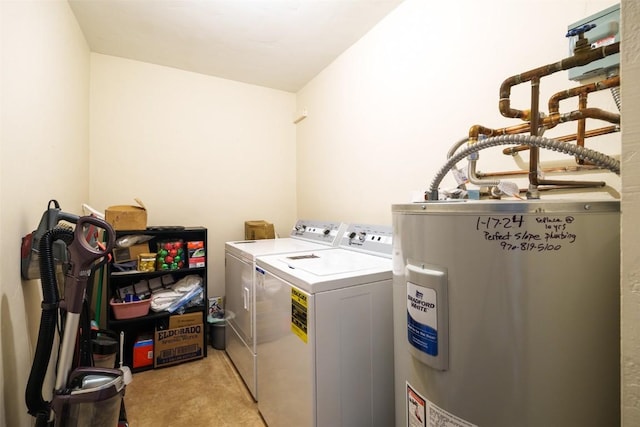 laundry area with washer and dryer, light colored carpet, electric water heater, and laundry area