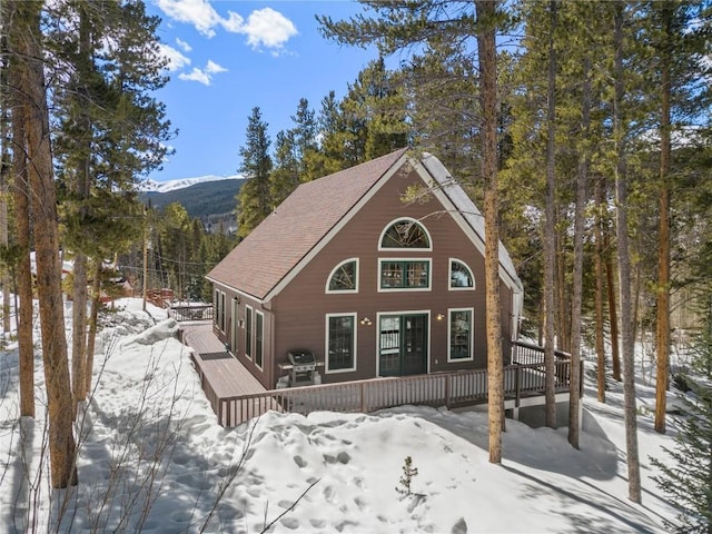 view of front of house featuring a deck with mountain view