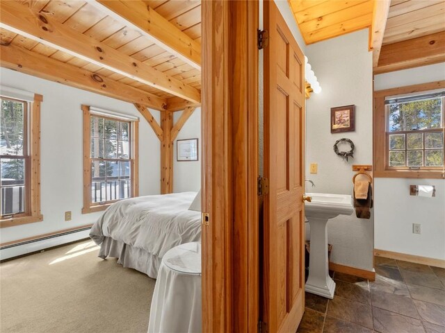 bedroom with beam ceiling, wooden ceiling, and a baseboard heating unit