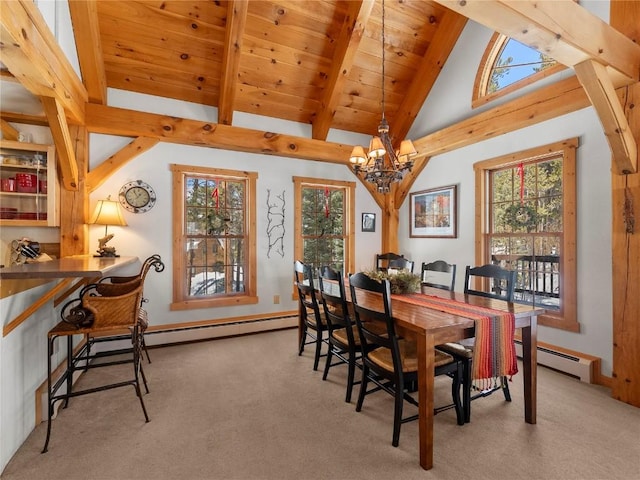 dining room with beamed ceiling, a notable chandelier, light colored carpet, and a baseboard heating unit