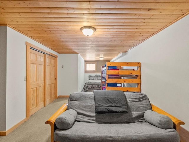 carpeted bedroom with ornamental molding and wood ceiling