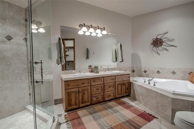 bathroom with tile patterned flooring, vanity, and independent shower and bath