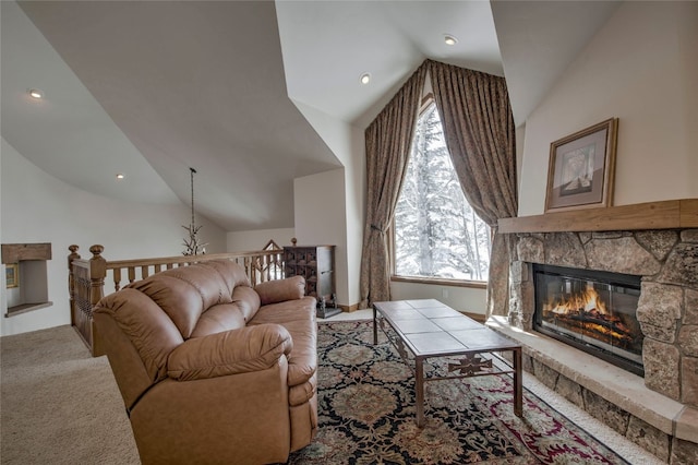 carpeted living room featuring a fireplace and lofted ceiling