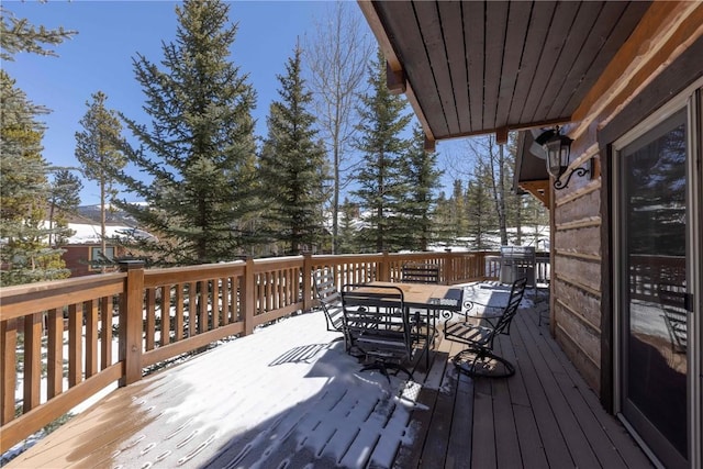 view of snow covered deck