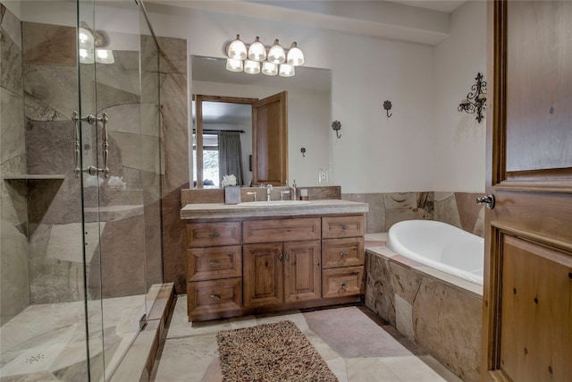 bathroom with vanity and separate shower and tub