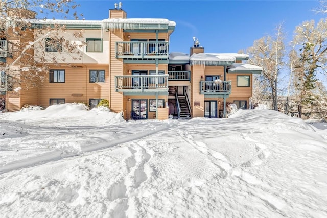 view of snow covered house