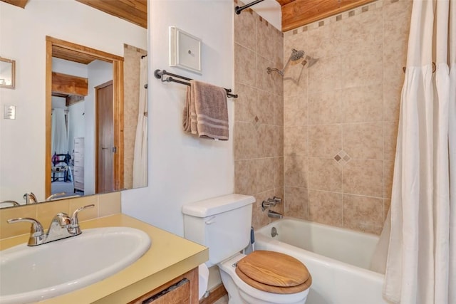 full bathroom featuring vanity, shower / bathtub combination with curtain, and toilet