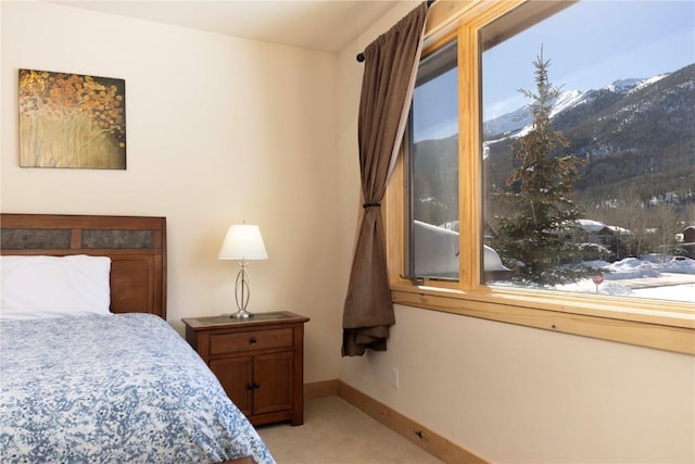 carpeted bedroom featuring a mountain view