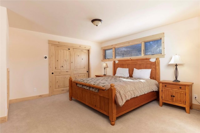 bedroom featuring light colored carpet