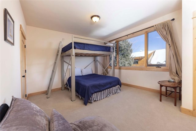 bedroom featuring light carpet