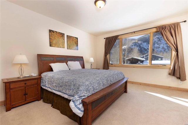 bedroom featuring light carpet