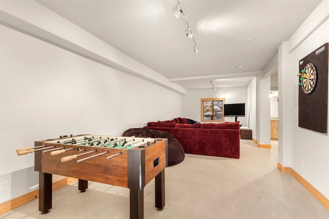 game room featuring light carpet and track lighting