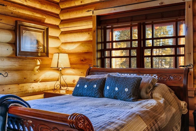 bedroom featuring rustic walls