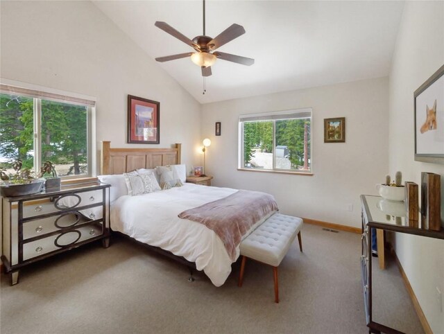 bedroom with multiple windows, ceiling fan, carpet, and high vaulted ceiling