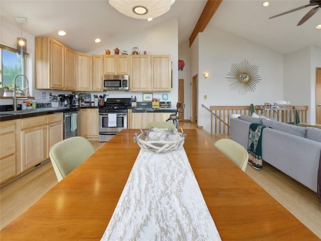 kitchen featuring sink, light hardwood / wood-style floors, light brown cabinets, and appliances with stainless steel finishes