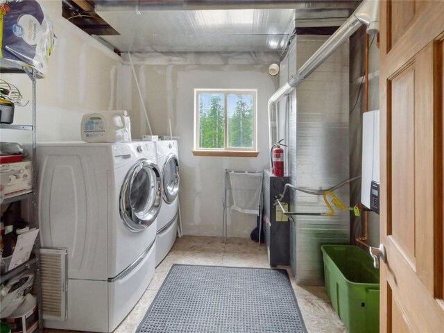 laundry room with independent washer and dryer