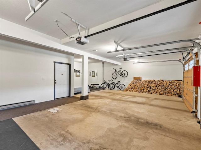 garage featuring a garage door opener and baseboard heating