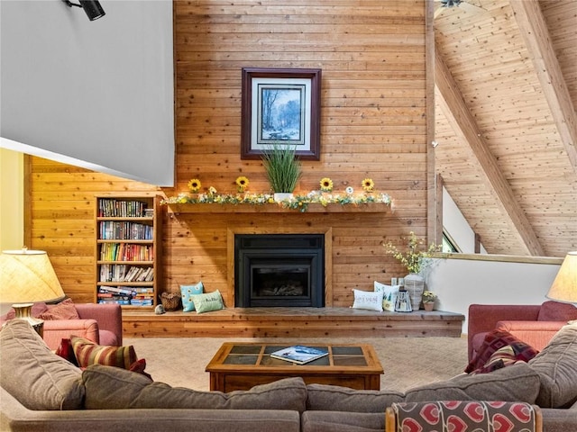 living room featuring vaulted ceiling with beams, wood walls, and wood ceiling