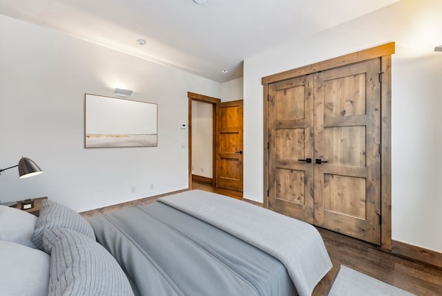 bedroom with hardwood / wood-style floors