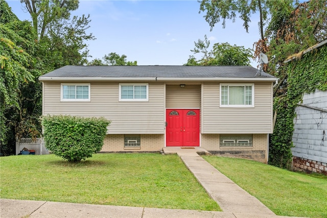 bi-level home with a front yard