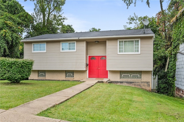 raised ranch with a front lawn