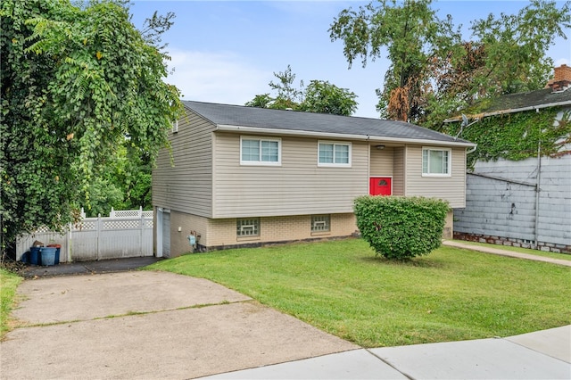 bi-level home with a front yard