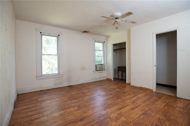 empty room featuring ceiling fan and dark hardwood / wood-style floors