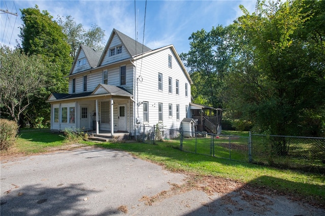 view of home's exterior with a lawn