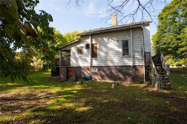 view of side of property with a yard