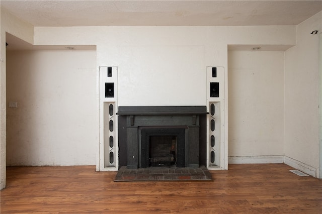 interior space with a fireplace and dark wood-type flooring